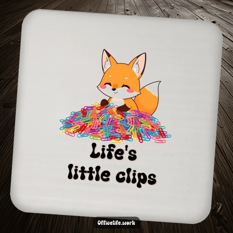 Funny drink coaster featuring a happy fox enthusiastically sorting a huge pile of colorful paper clips, protecting surfaces with humor.