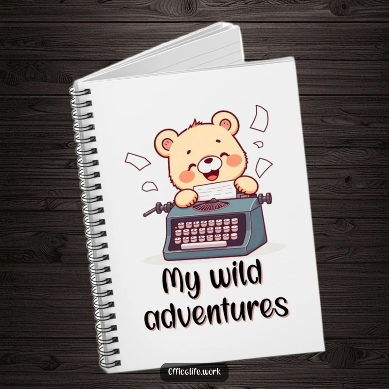 Funny notebook featuring a cheerful bear cub typing enthusiastically on a vintage typewriter, papers flying wildly.